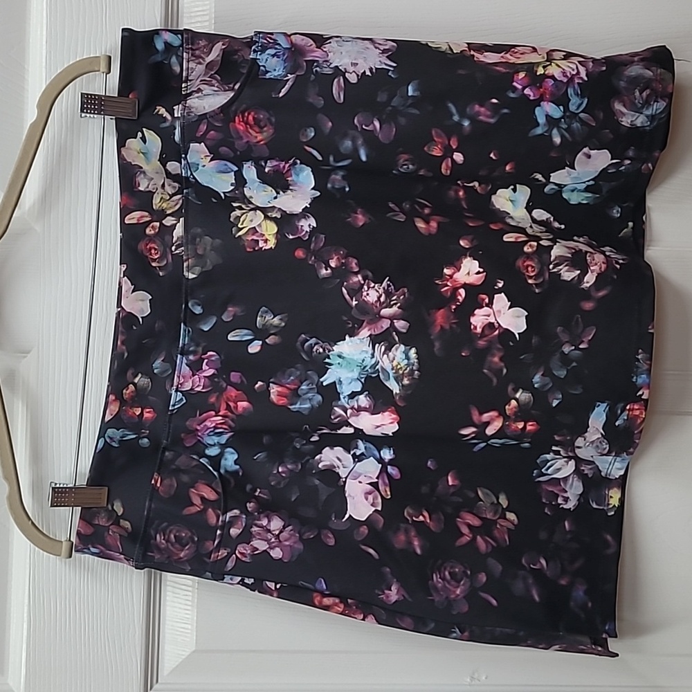 Short black skort with blue and pink flowers.